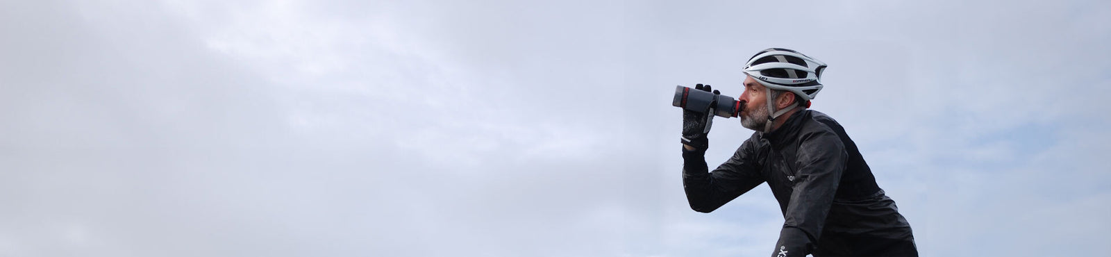 CYCLIST DRINKING FROM WATER TO GO WATER FILTER BOTTLE