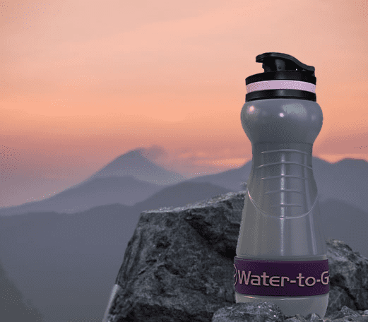Water to Go bioplastic water bottle with filter for travel with mountain background